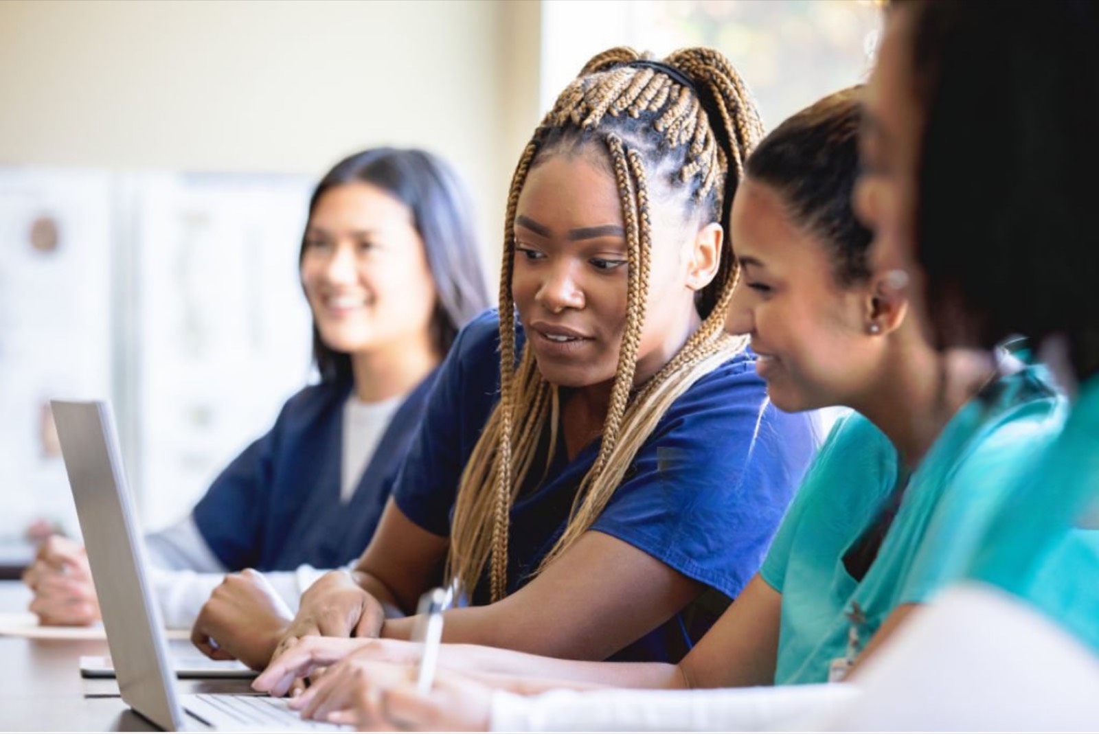 Caregivers studying together at Dadiva Online Training